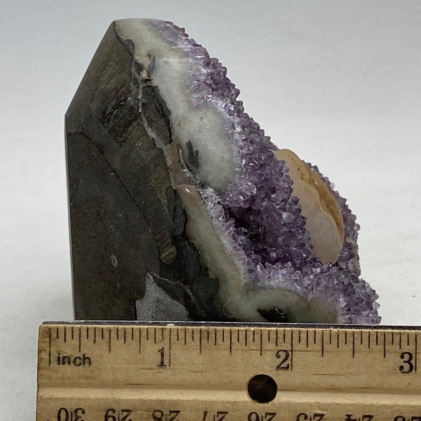Roccia Roba - Amethyst geode cluster on a wood base, rock decor