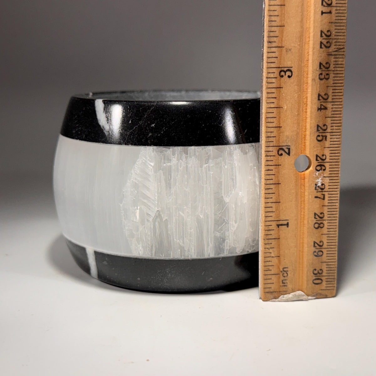 Selenite & marble tea light holder, white body with black rim, height measurement