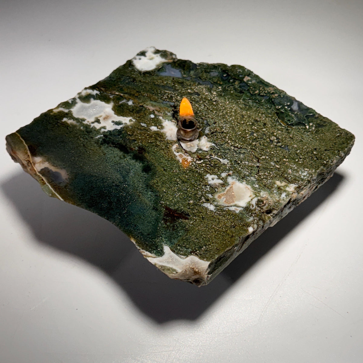 Moss agate rock candle oil lamp with flame wick in irregular green stone slab