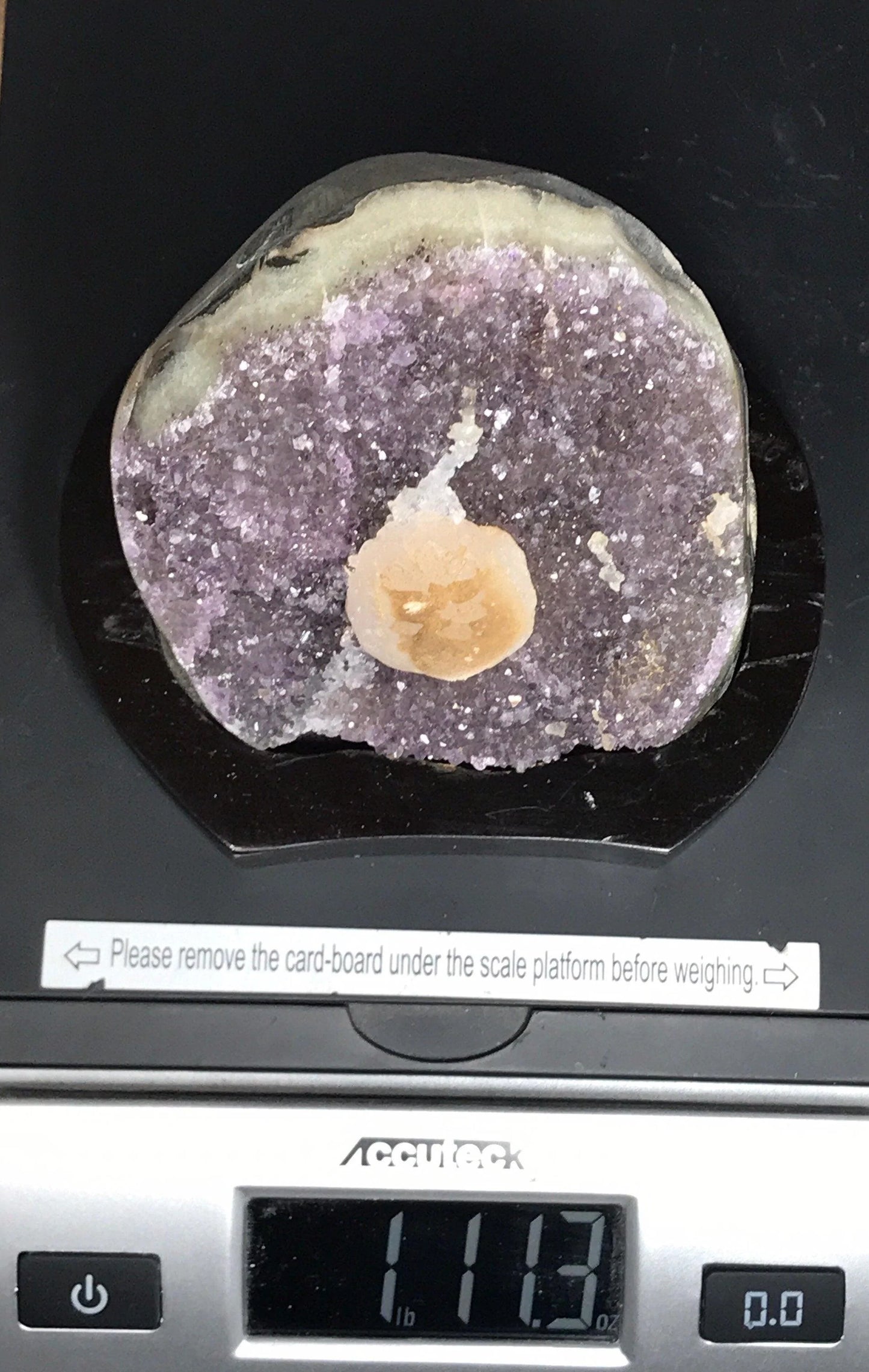 Amethyst geode with calcite on a wood base - RocciaRoba