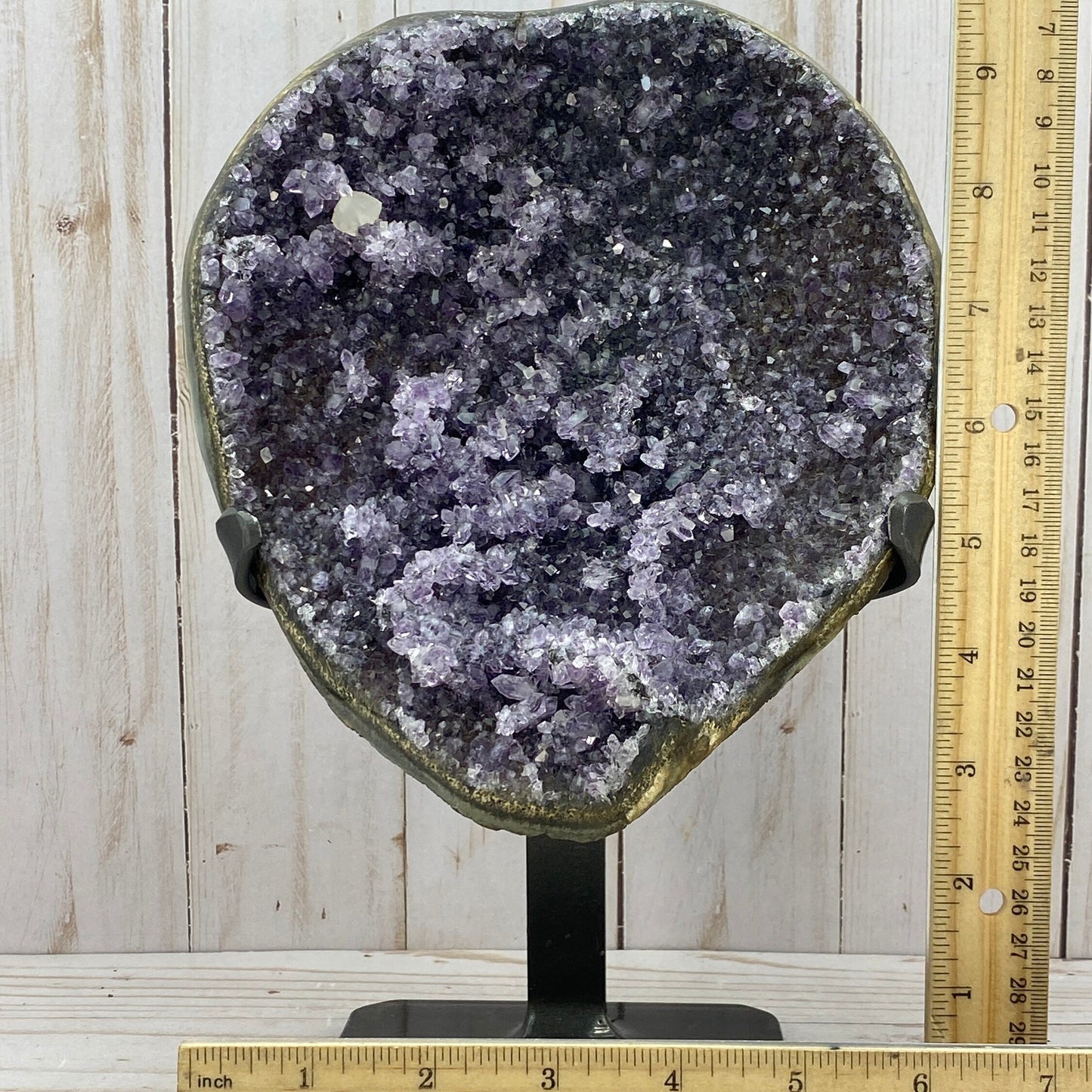 Amethyst geode cluster in metal stand