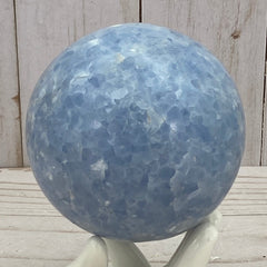 Blue calcite sphere in stand