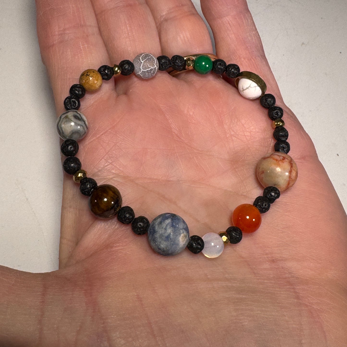 Roccia Roba - You are the Sun stretchy bead bracelet small size in woman’s palm