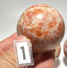 [shopname] - Sunstone sphere in acrylic stand, rock decor