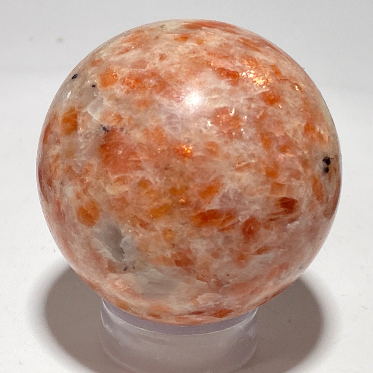 [shopname] - Sunstone sphere in acrylic stand, rock decor