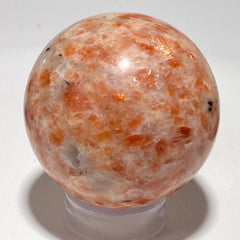 [shopname] - Sunstone sphere in acrylic stand, rock decor