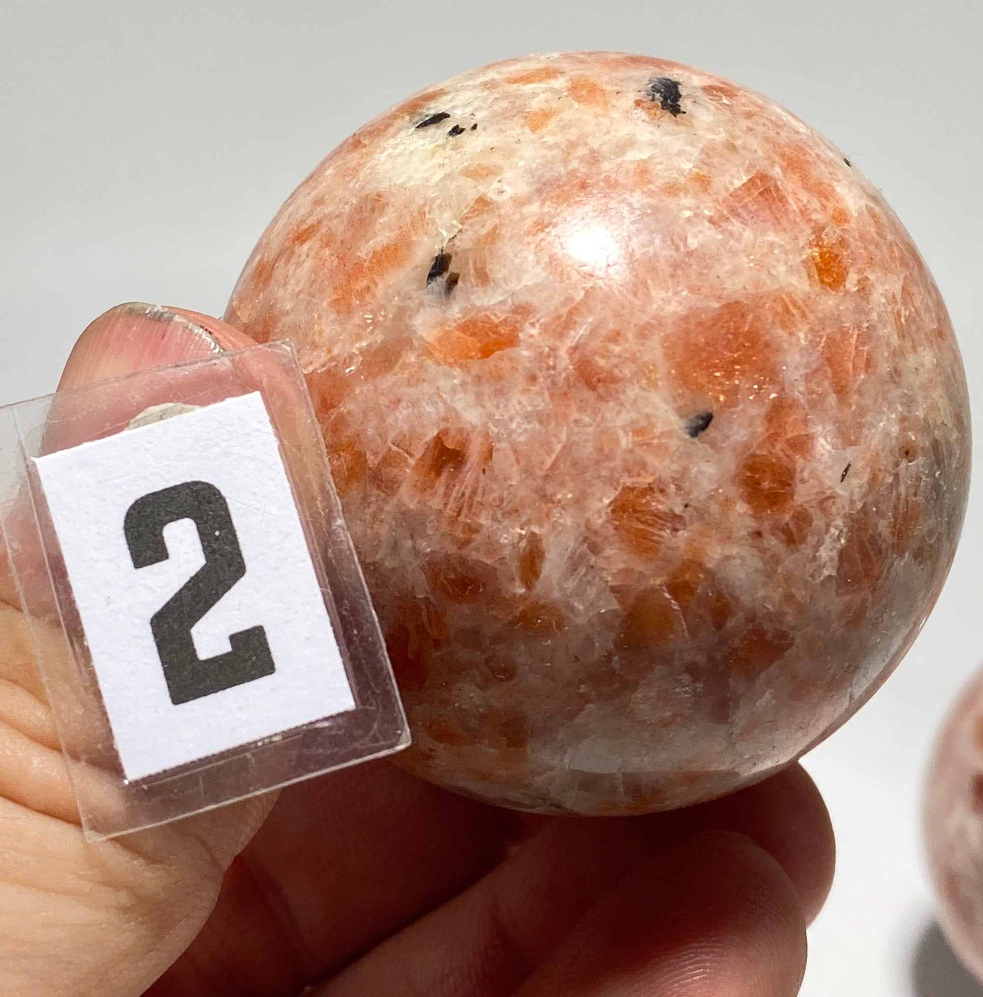 [shopname] - Sunstone sphere in acrylic stand, rock decor