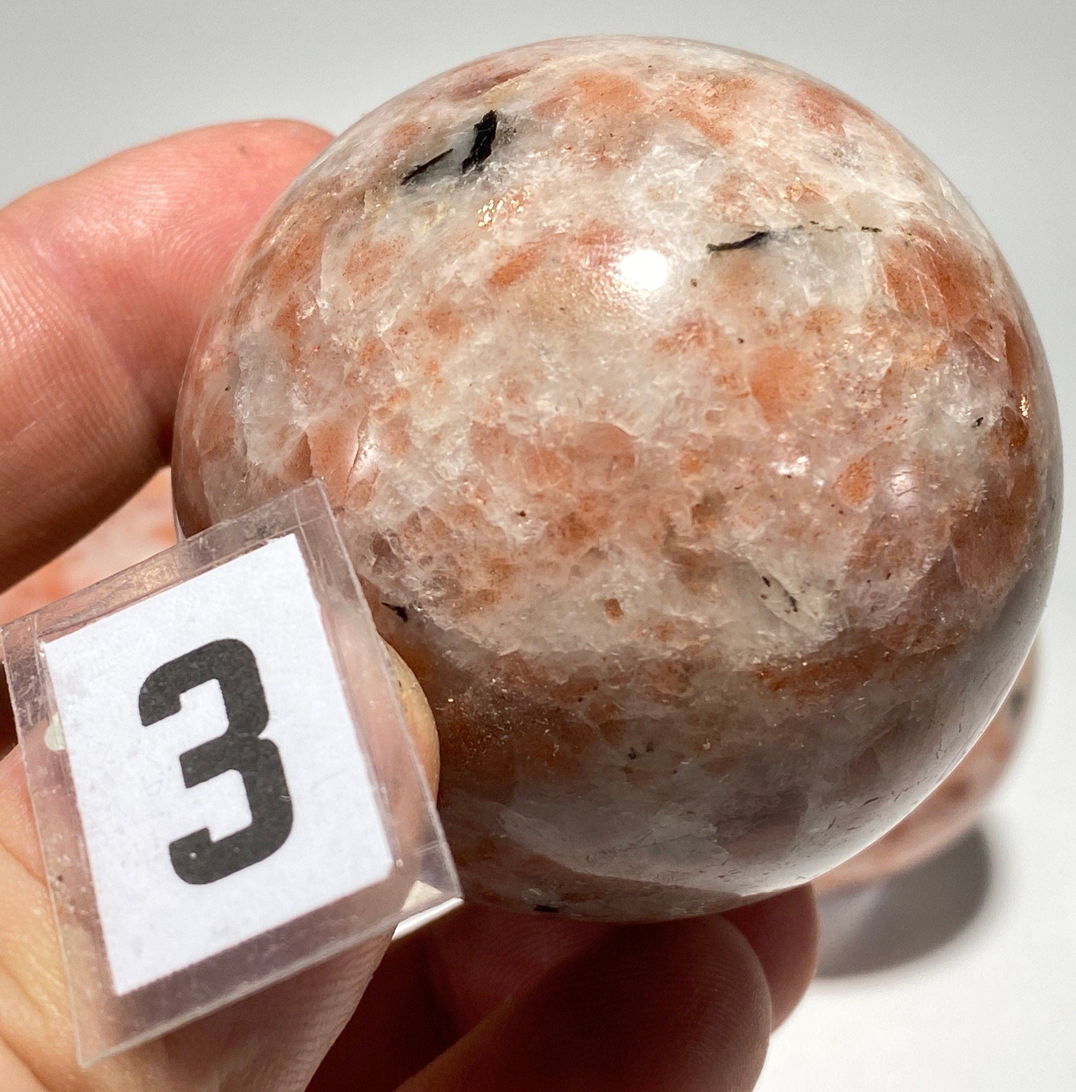 [shopname] - Sunstone sphere in acrylic stand, rock decor