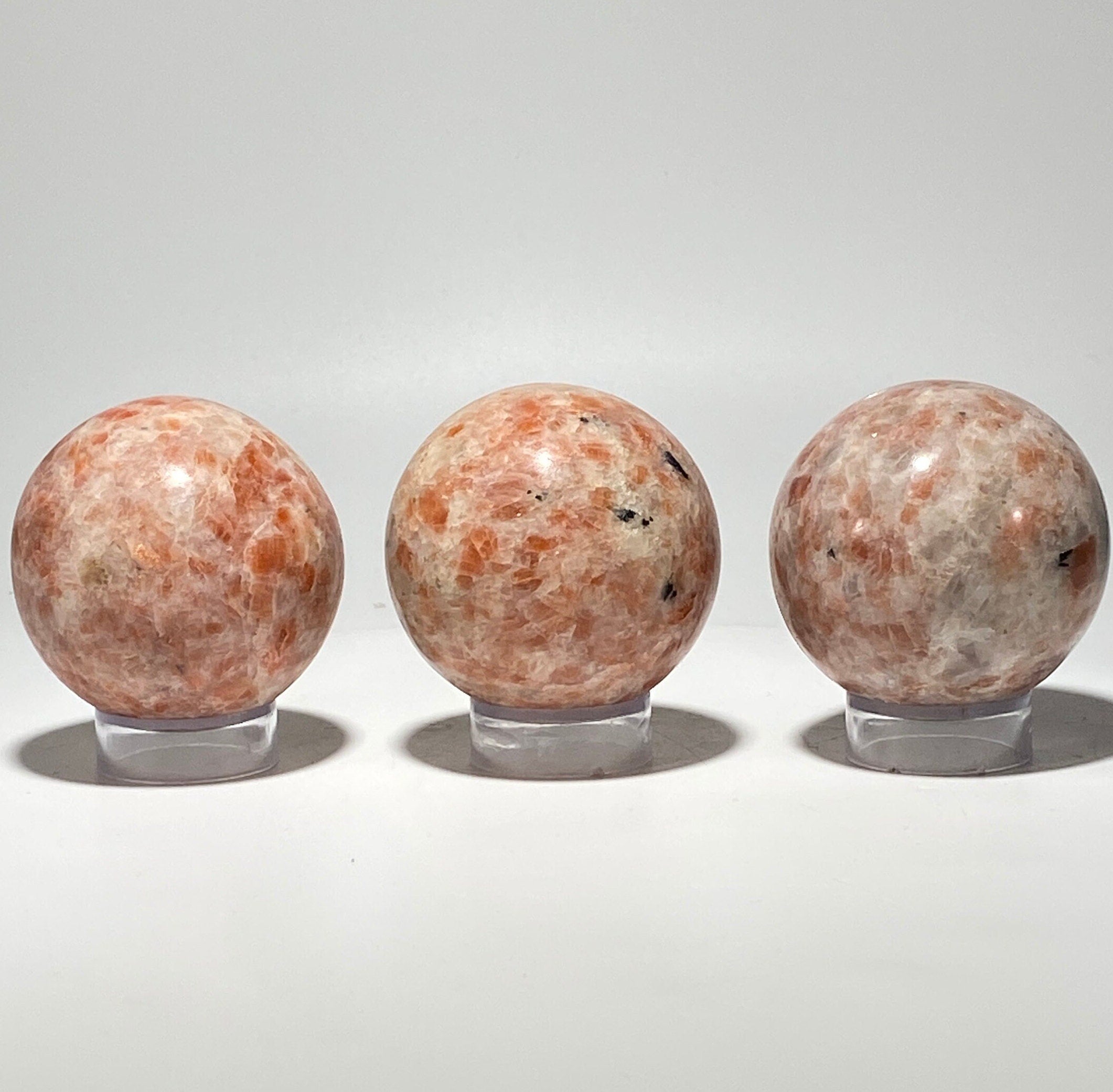 [shopname] - Sunstone sphere in acrylic stand, rock decor