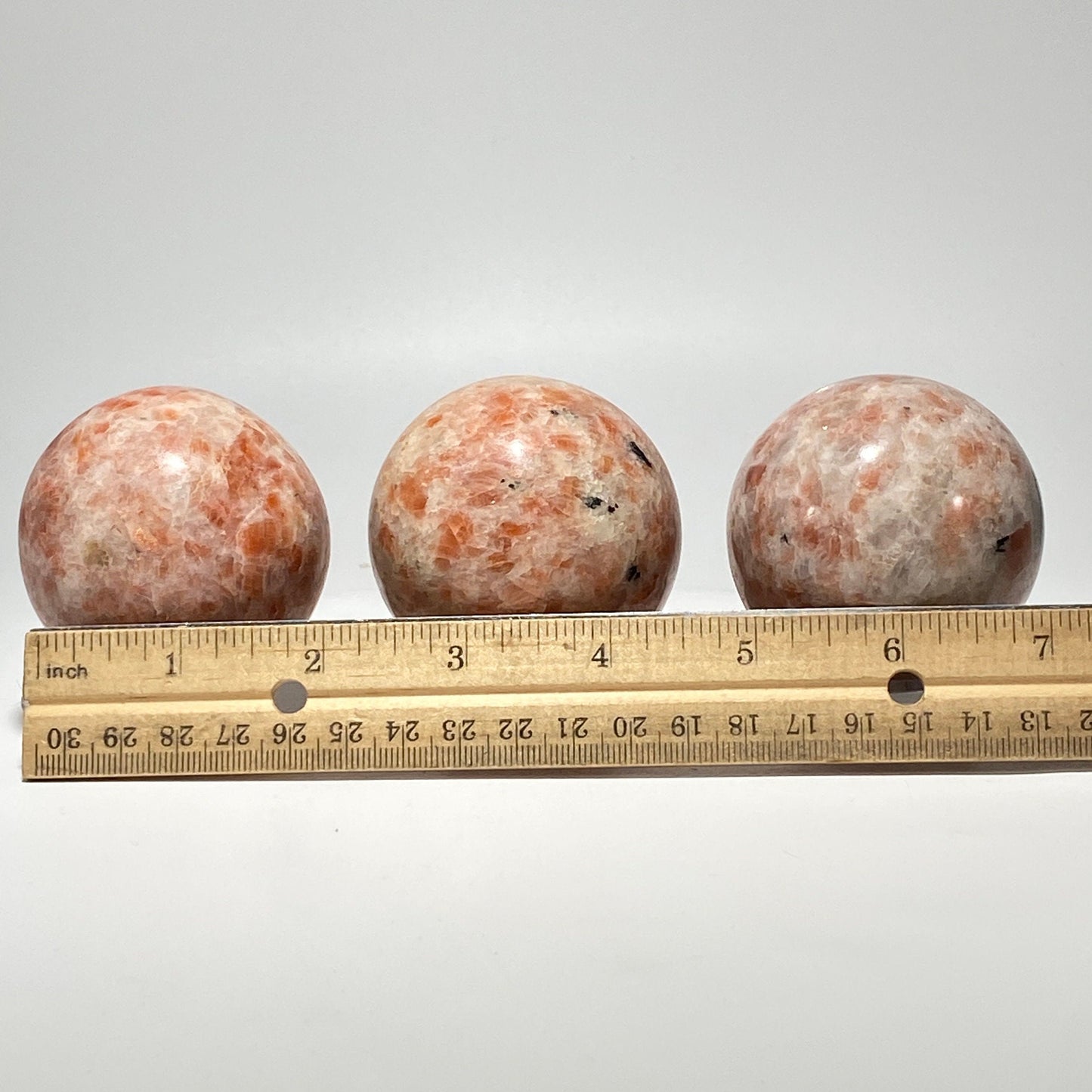 [shopname] - Sunstone sphere in acrylic stand, rock decor