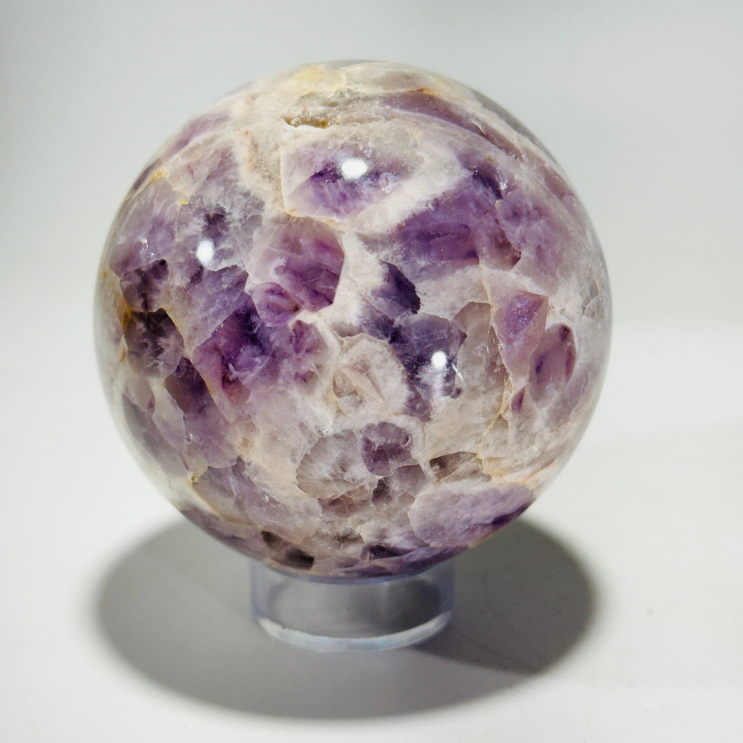 Amethyst sphere in acrylic stand