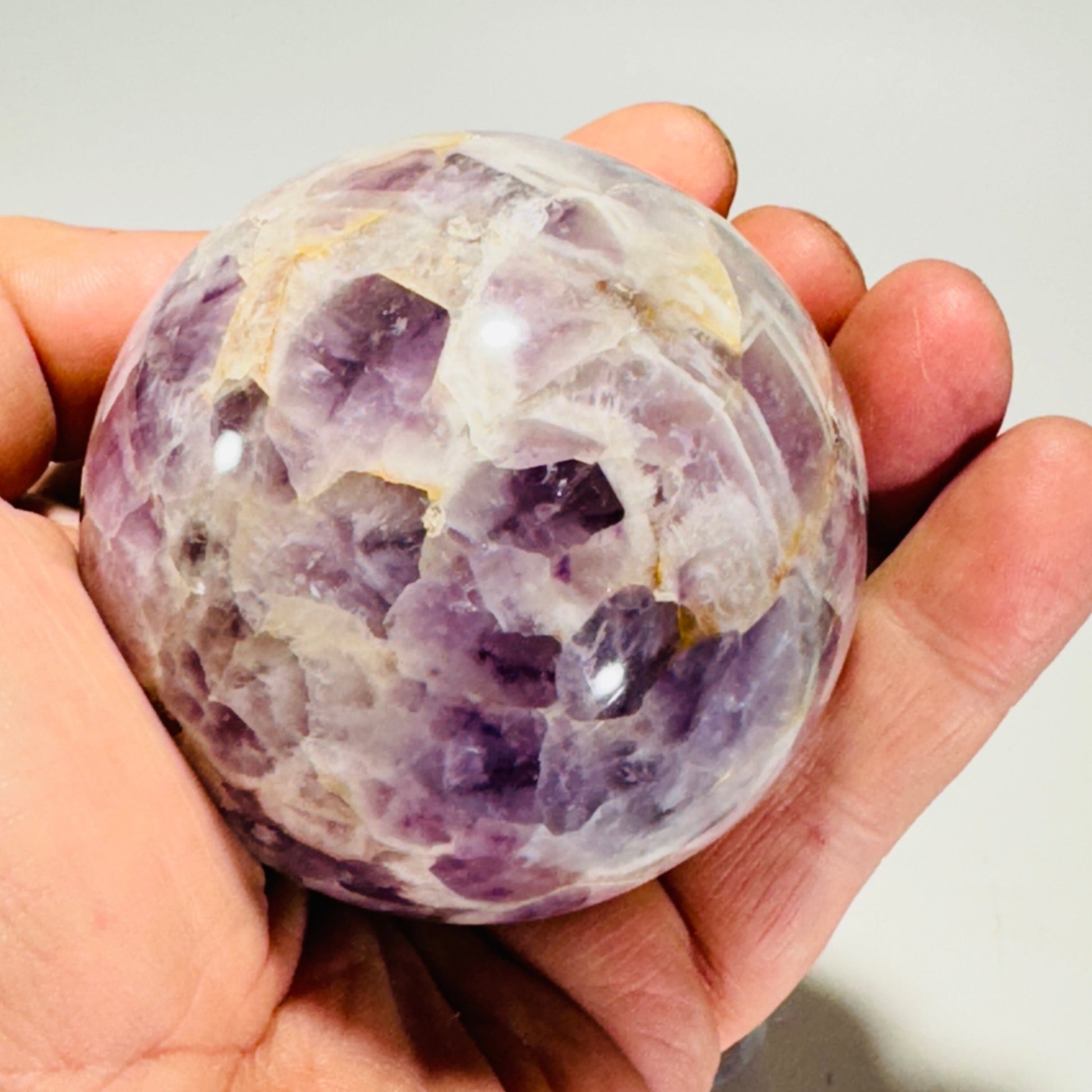 Amethyst sphere in acrylic stand