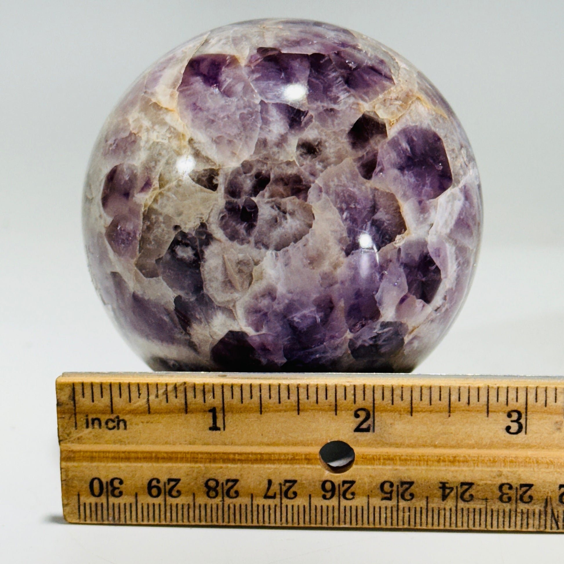 Amethyst sphere in acrylic stand