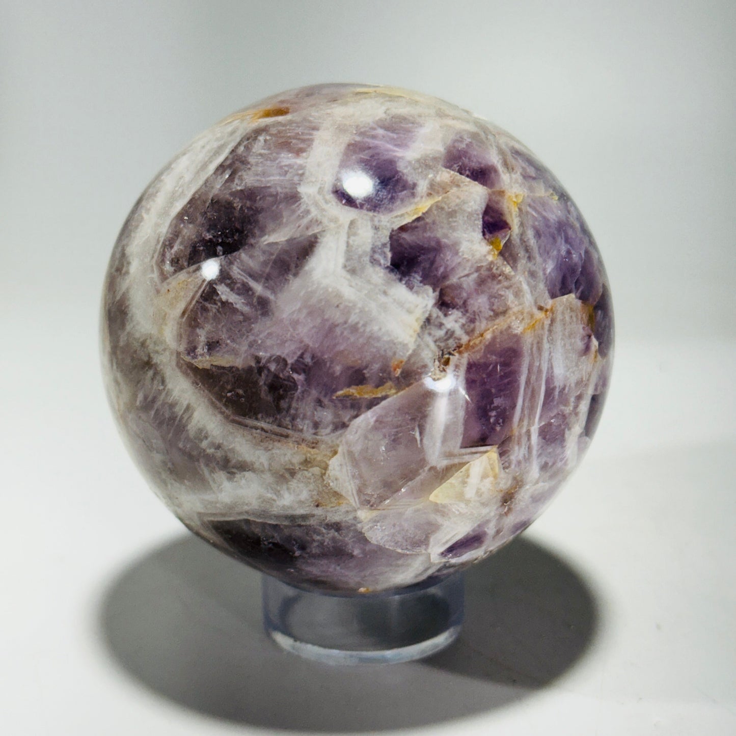 Amethyst sphere in acrylic stand