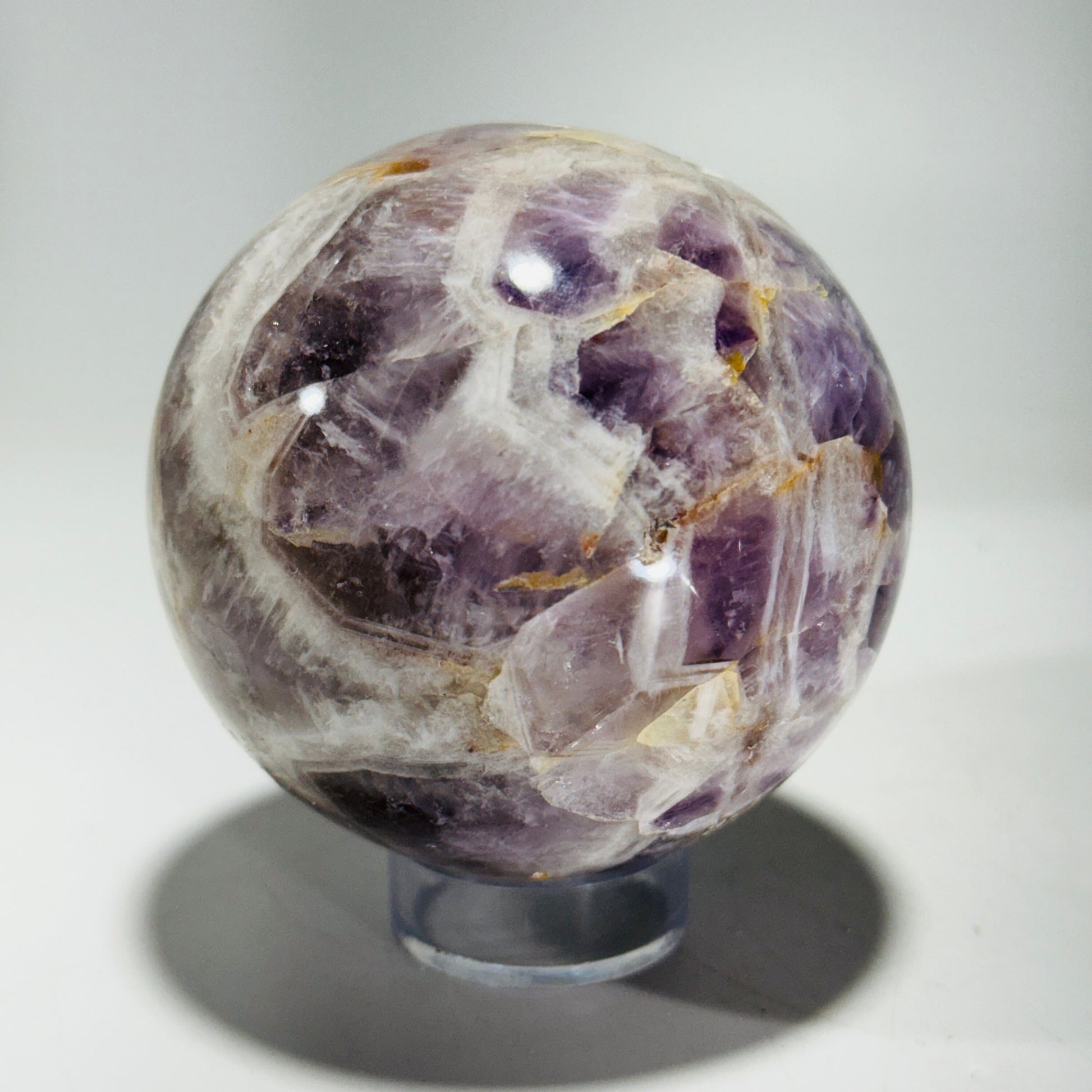 Amethyst sphere in acrylic stand