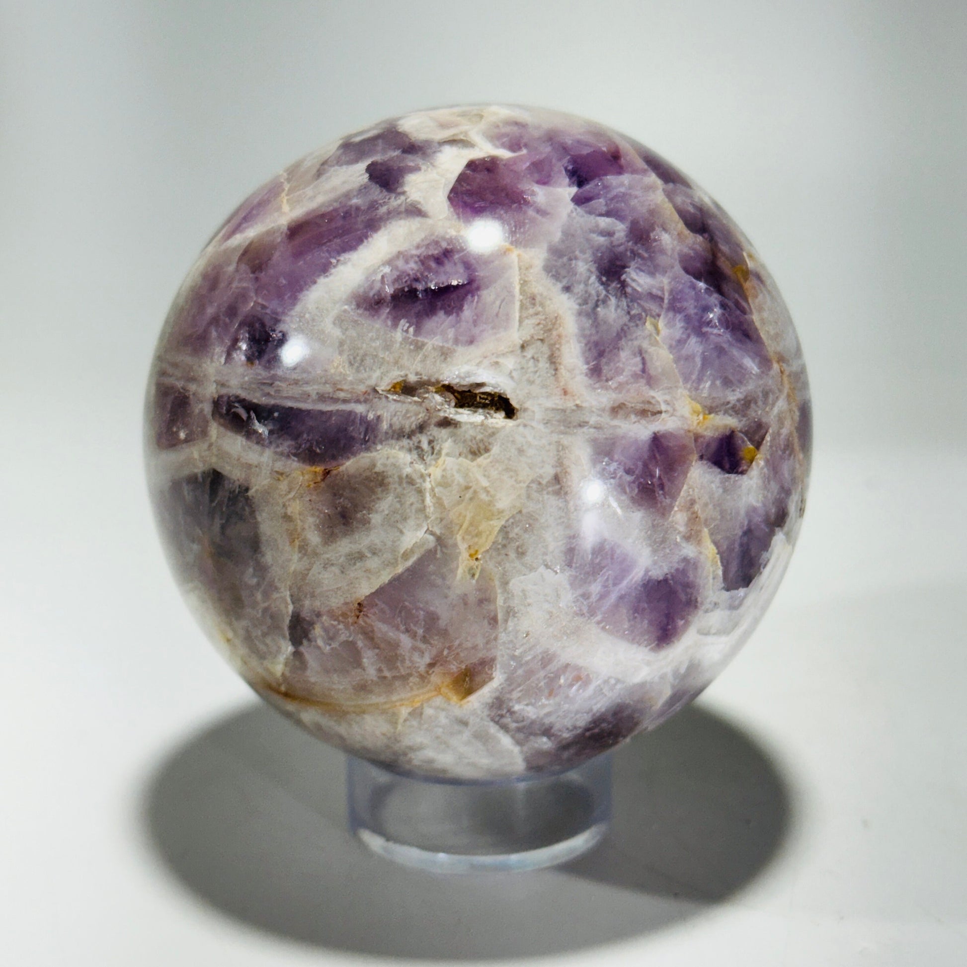 Amethyst sphere in acrylic stand