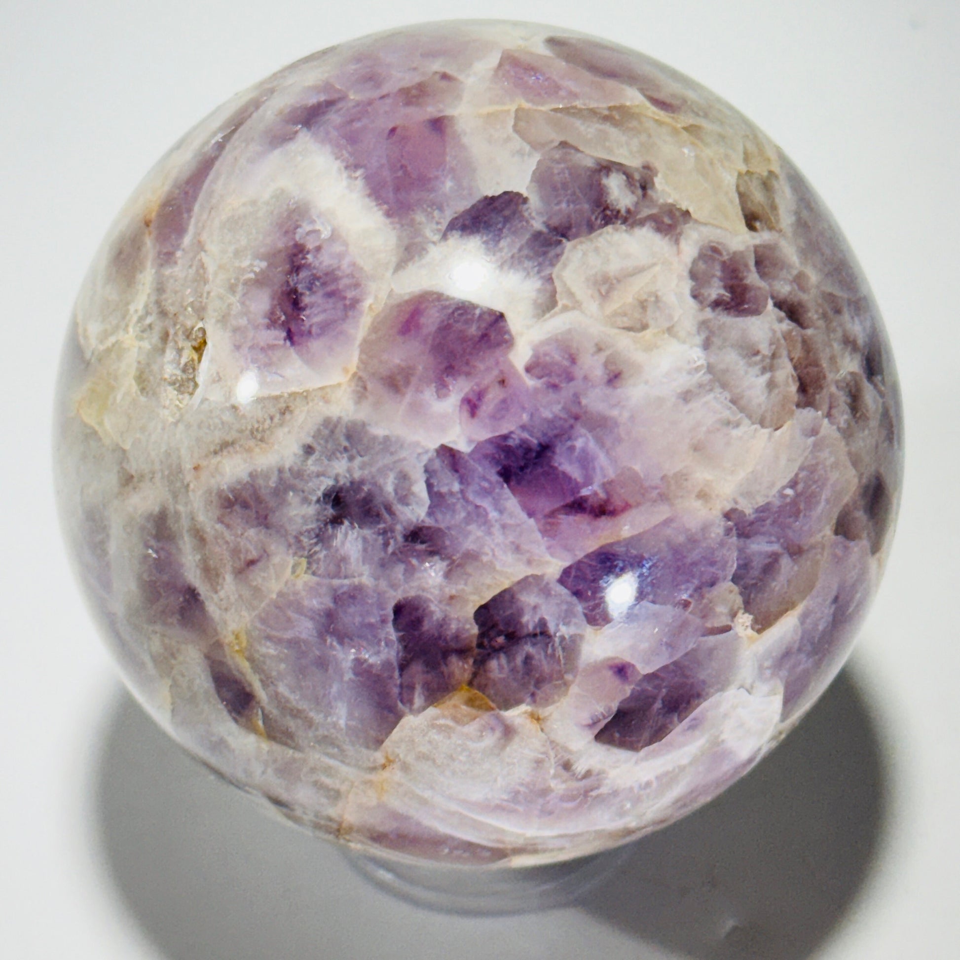 Amethyst sphere in acrylic stand