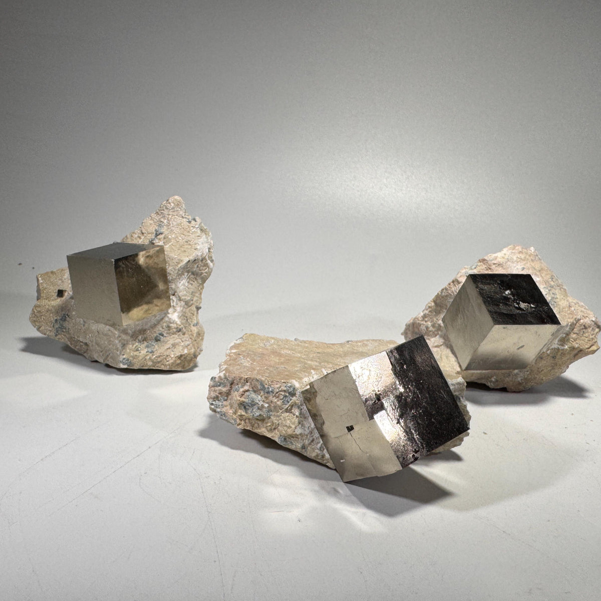 Pyrite crystal in matrix set, featuring dark blocky pyrite cubes