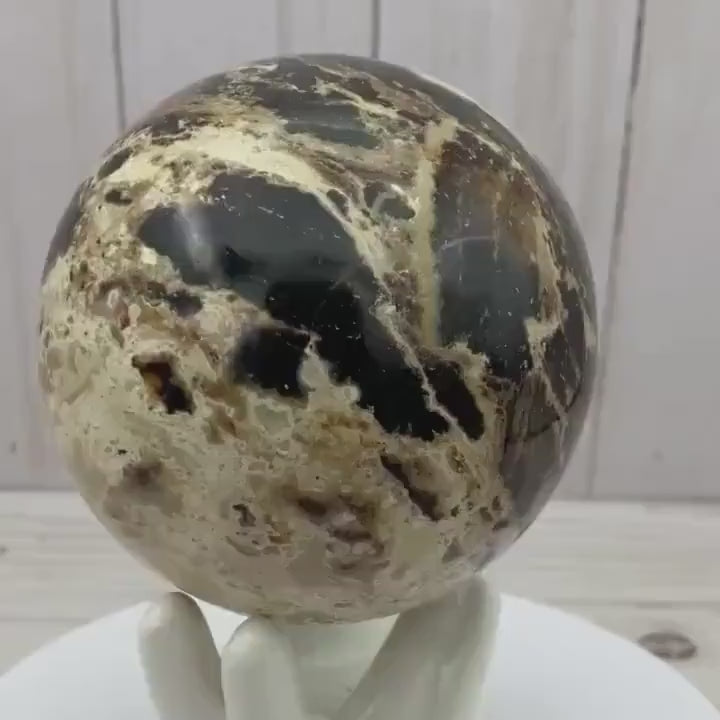 Black opal sphere in acrylic stand