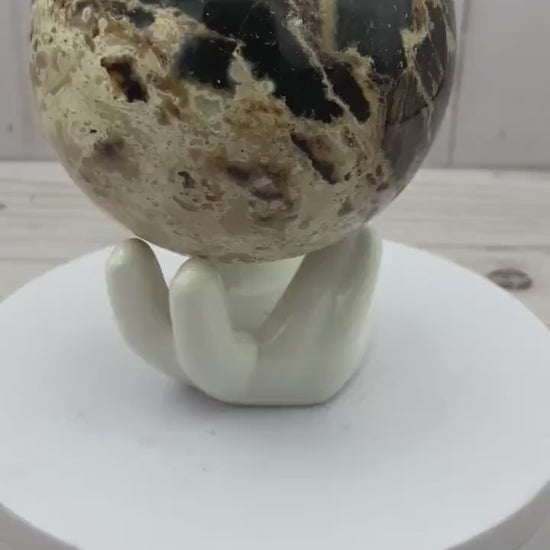 Black opal sphere in acrylic stand