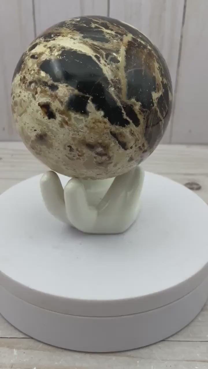 Black opal sphere in acrylic stand