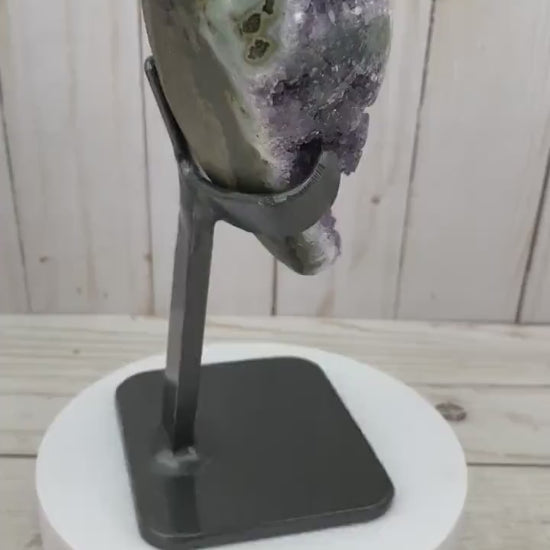 Amethyst geode with stalactite eyes