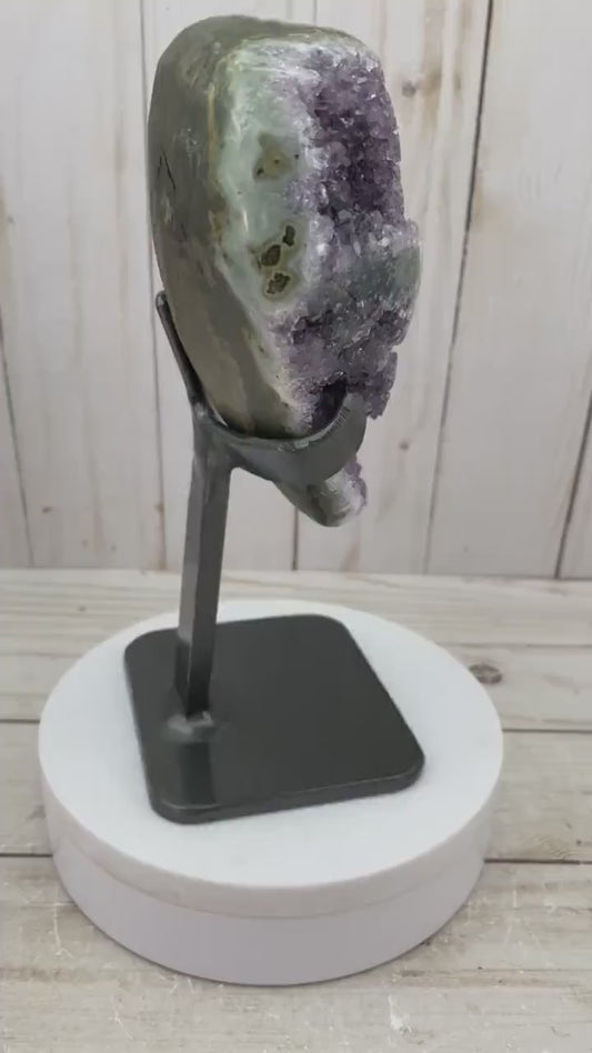 Amethyst geode with stalactite eyes