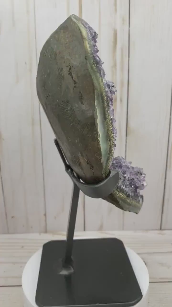 Amethyst geode cluster in metal stand
