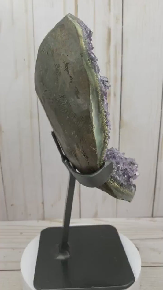 Amethyst geode cluster in metal stand