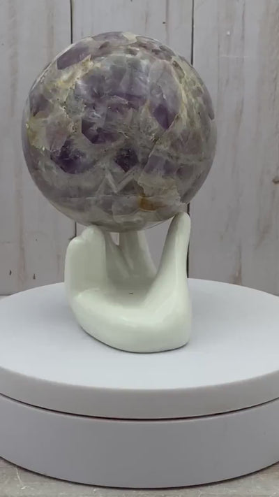 Amethyst sphere in acrylic stand