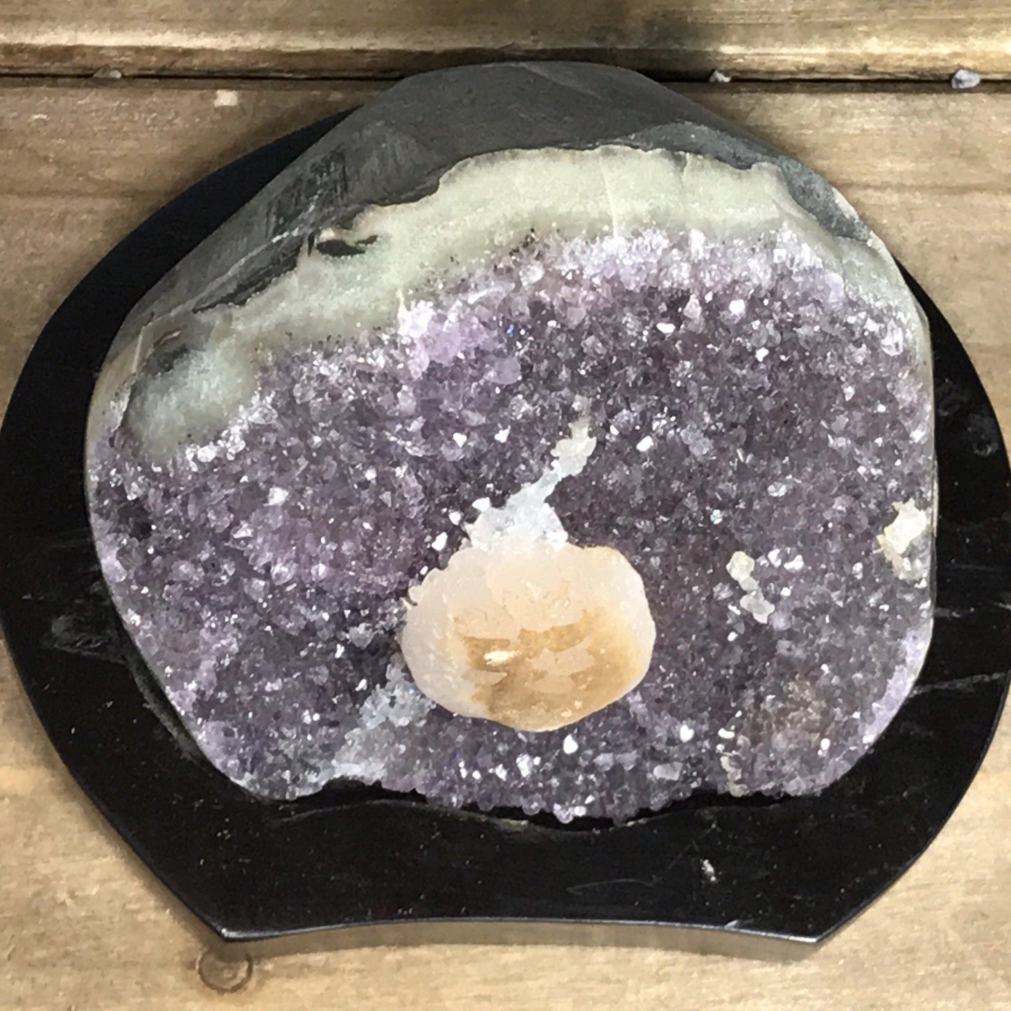 Amethyst geode with calcite on a wood base - RocciaRoba