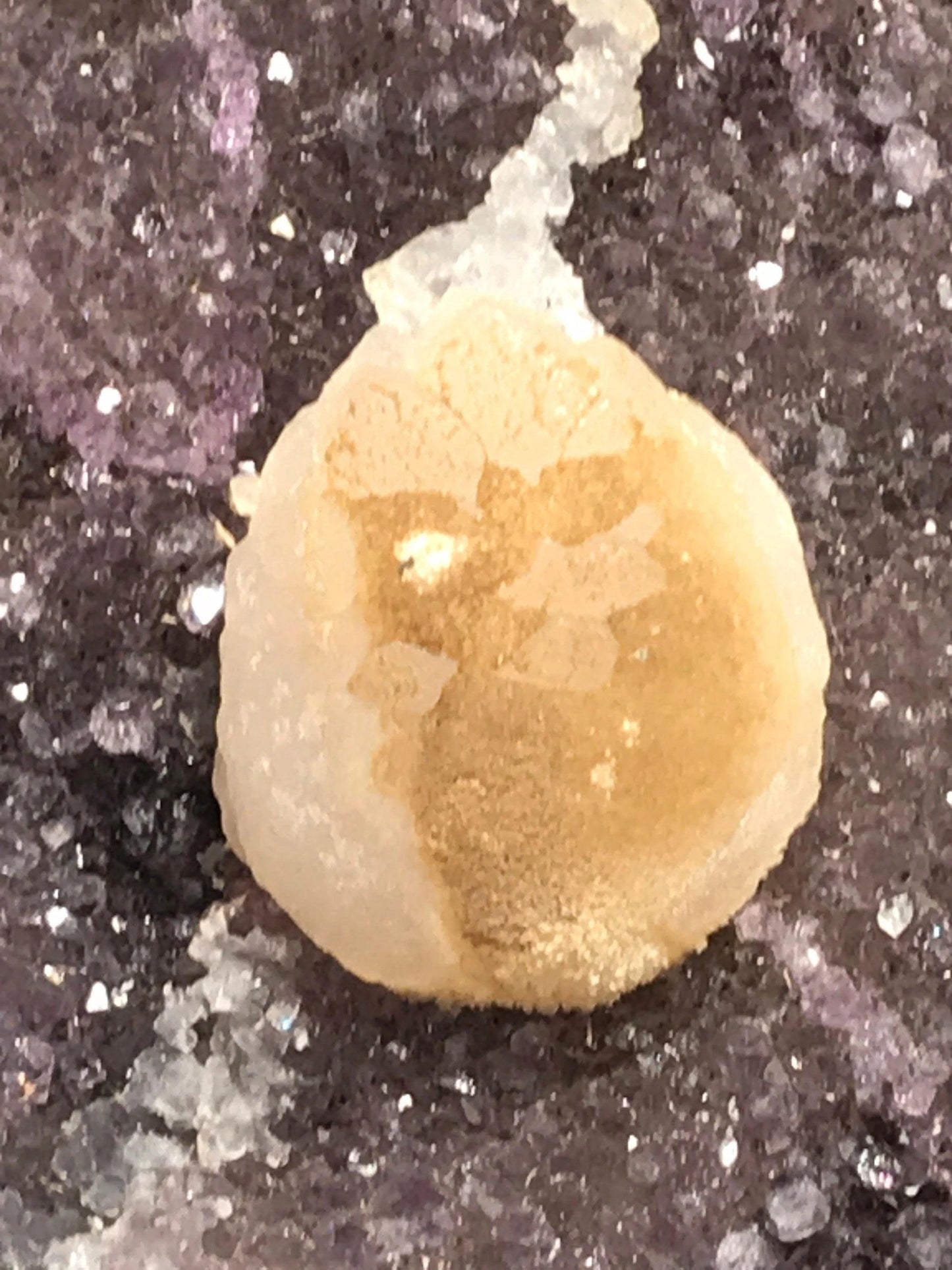 Amethyst geode with calcite on a wood base - RocciaRoba