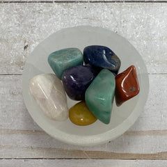 Chakra stones in a Selenite charging bowl