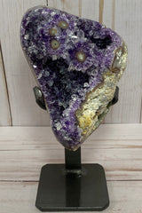 Dark purple amethyst cluster with stalactite eyes