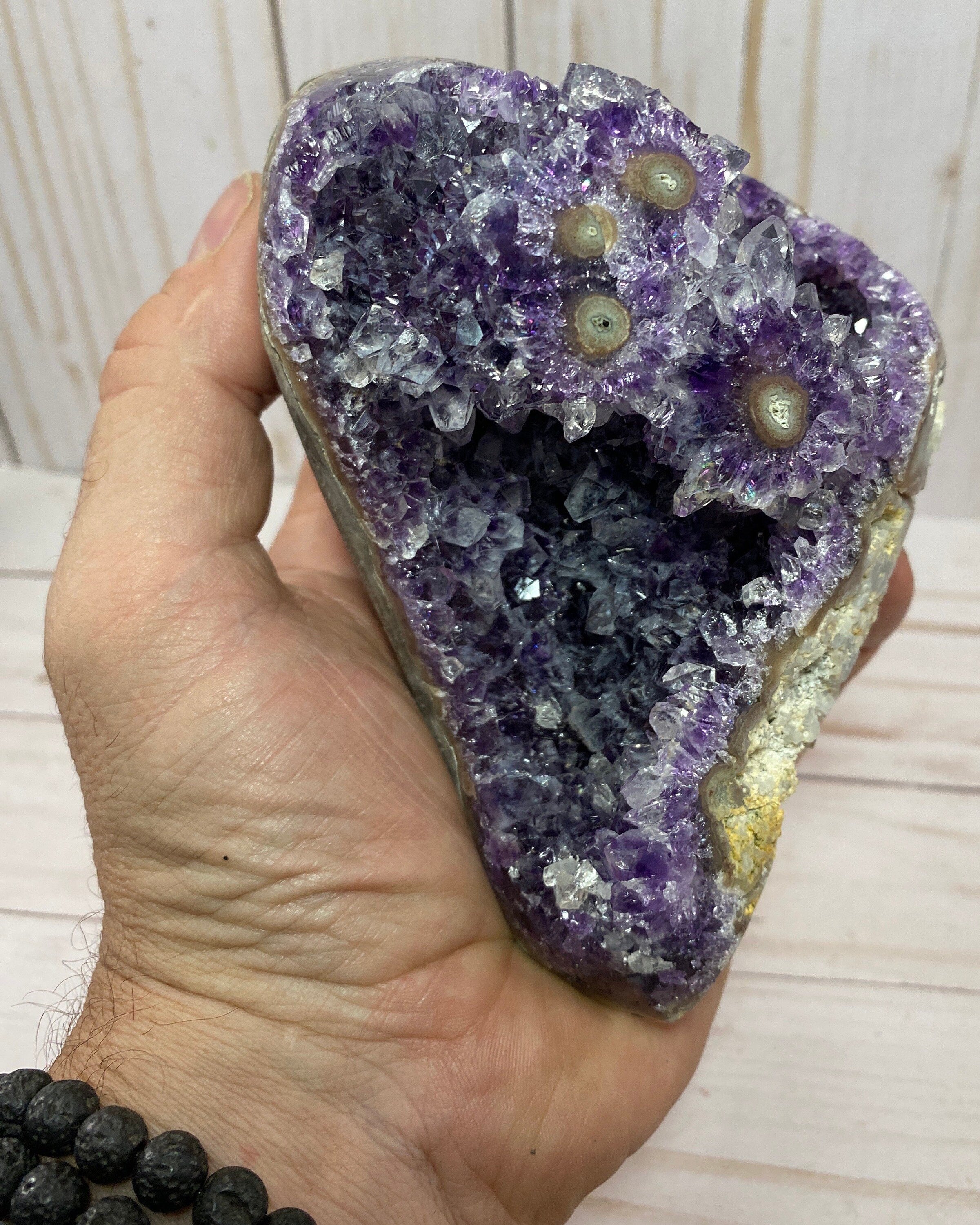 Dark purple amethyst cluster with stalactite eyes