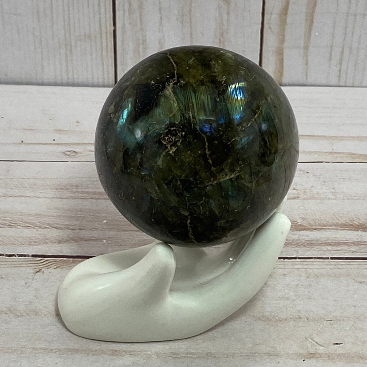 Labradorite sphere in acrylic stand