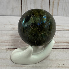 Labradorite sphere in acrylic stand