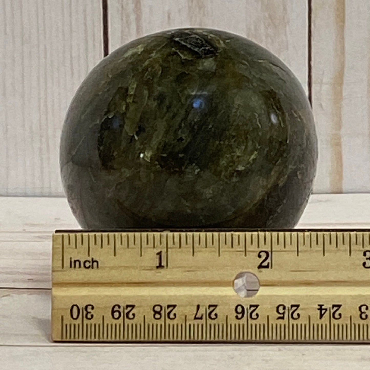 Labradorite sphere in acrylic stand