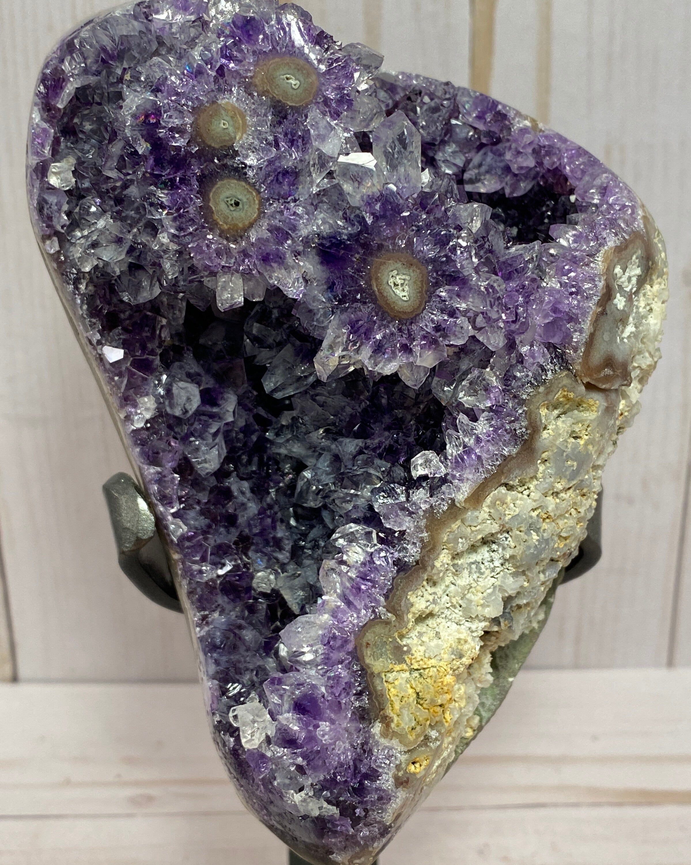 Dark purple amethyst cluster with stalactite eyes