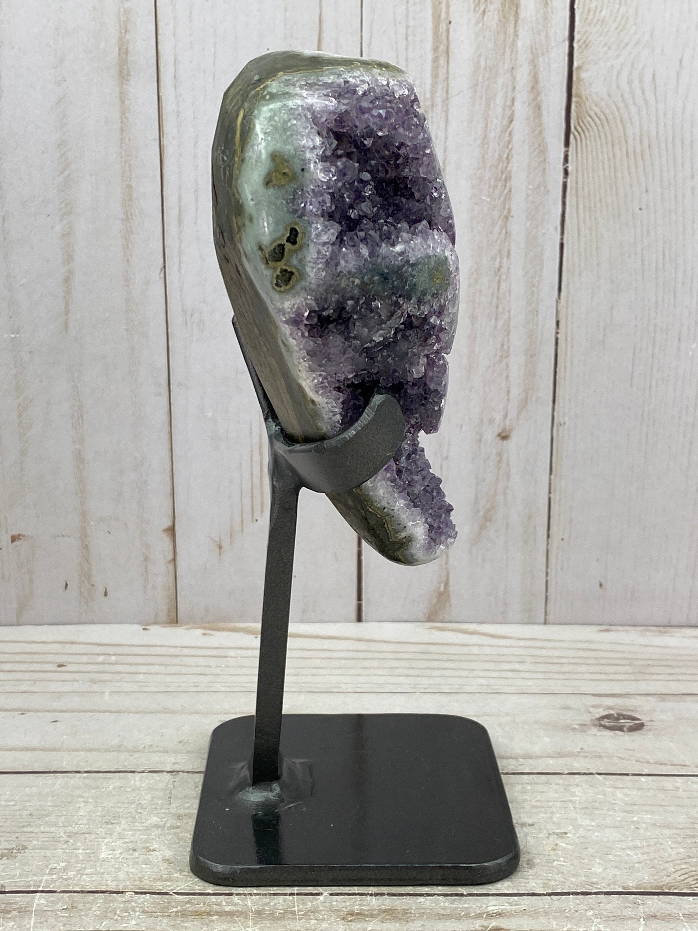 Amethyst geode with stalactite eyes