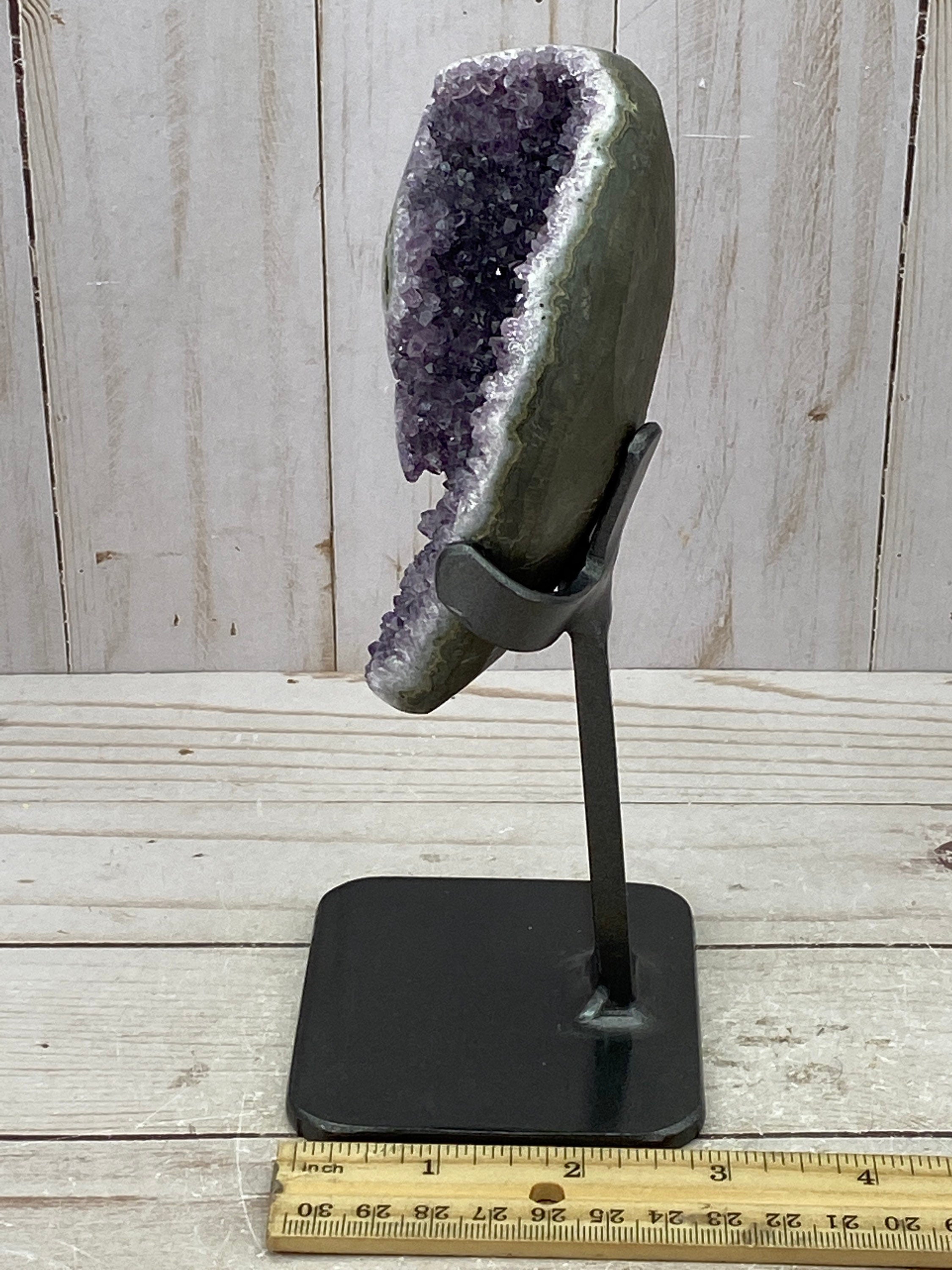 Amethyst geode with stalactite eyes