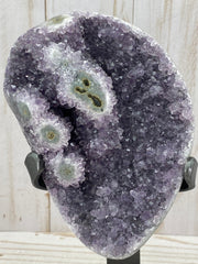 Amethyst geode with stalactite eyes