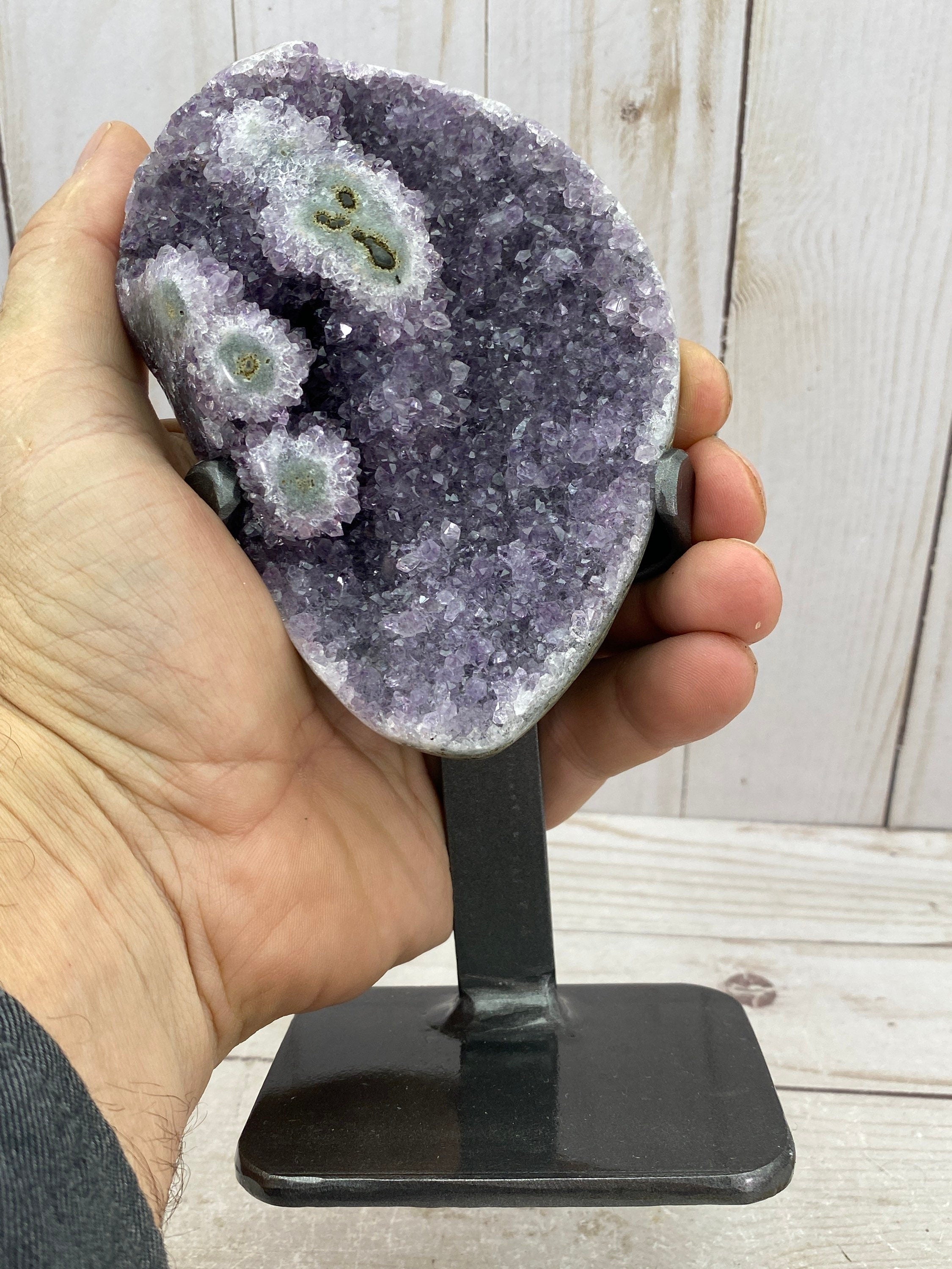 Amethyst geode with stalactite eyes