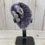 Amethyst geode with stalactite eyes