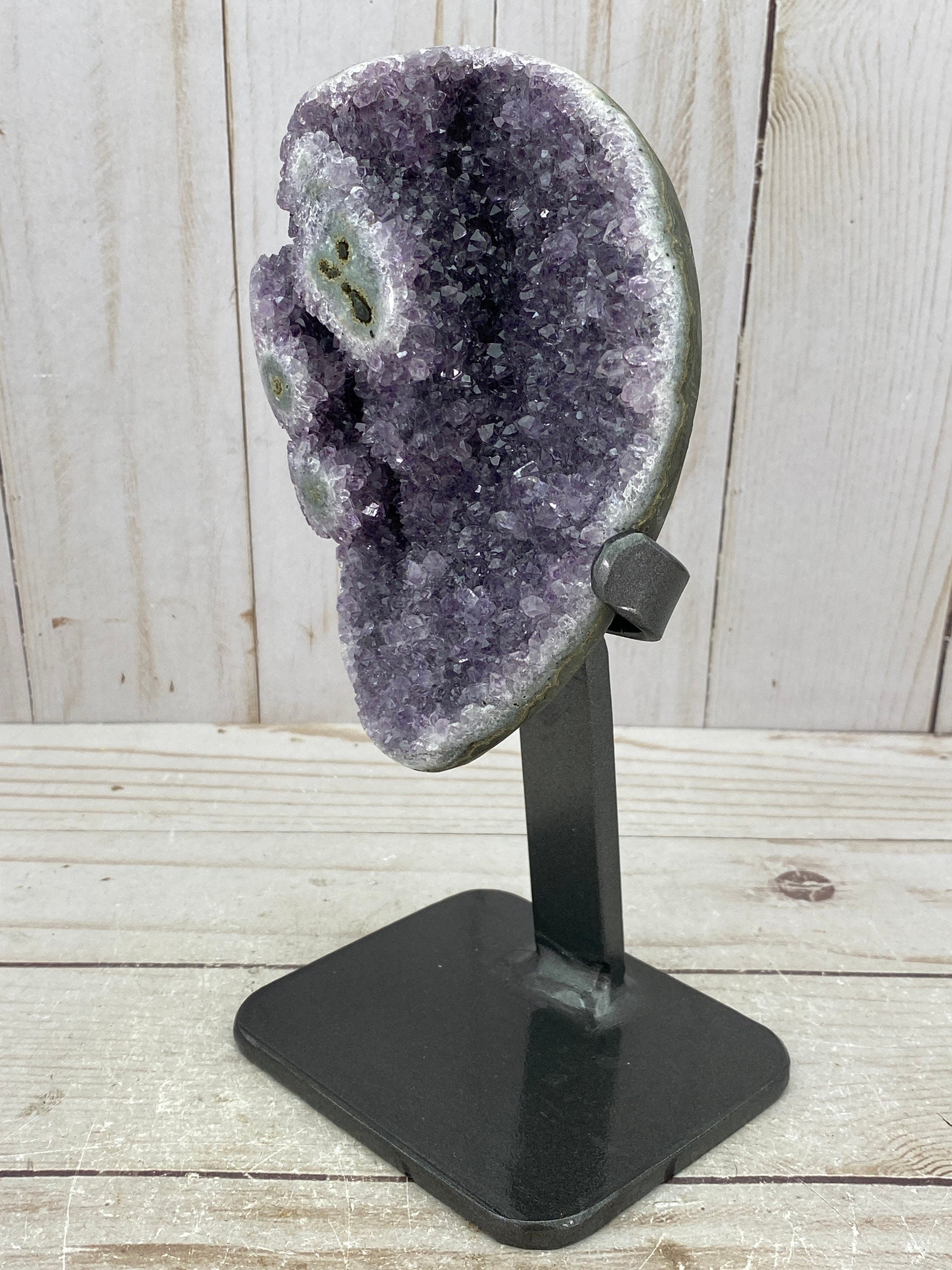 Amethyst geode with stalactite eyes