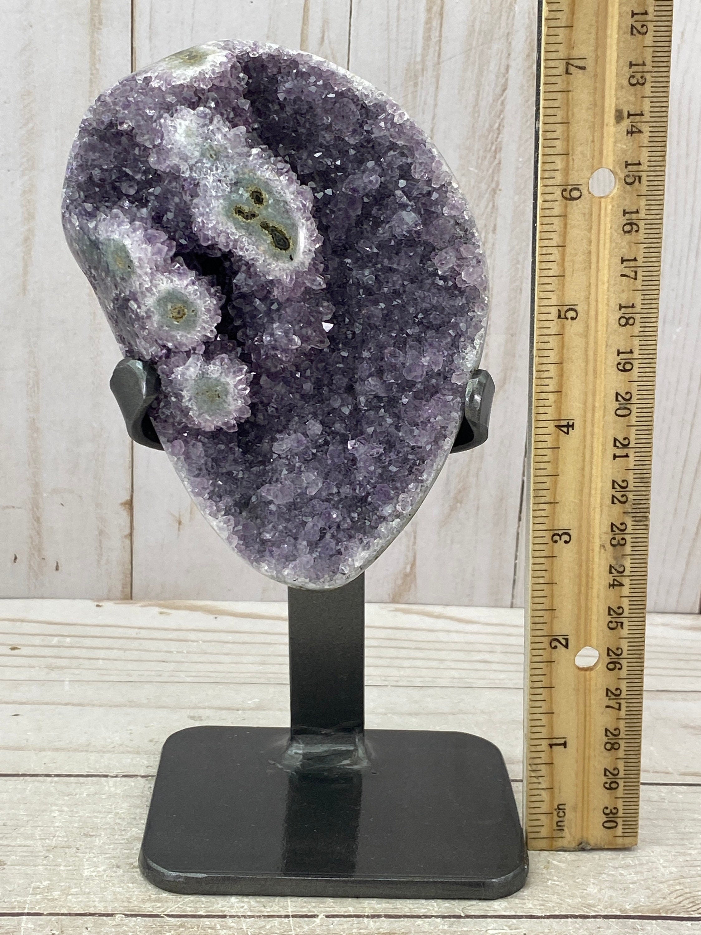 Amethyst geode with stalactite eyes