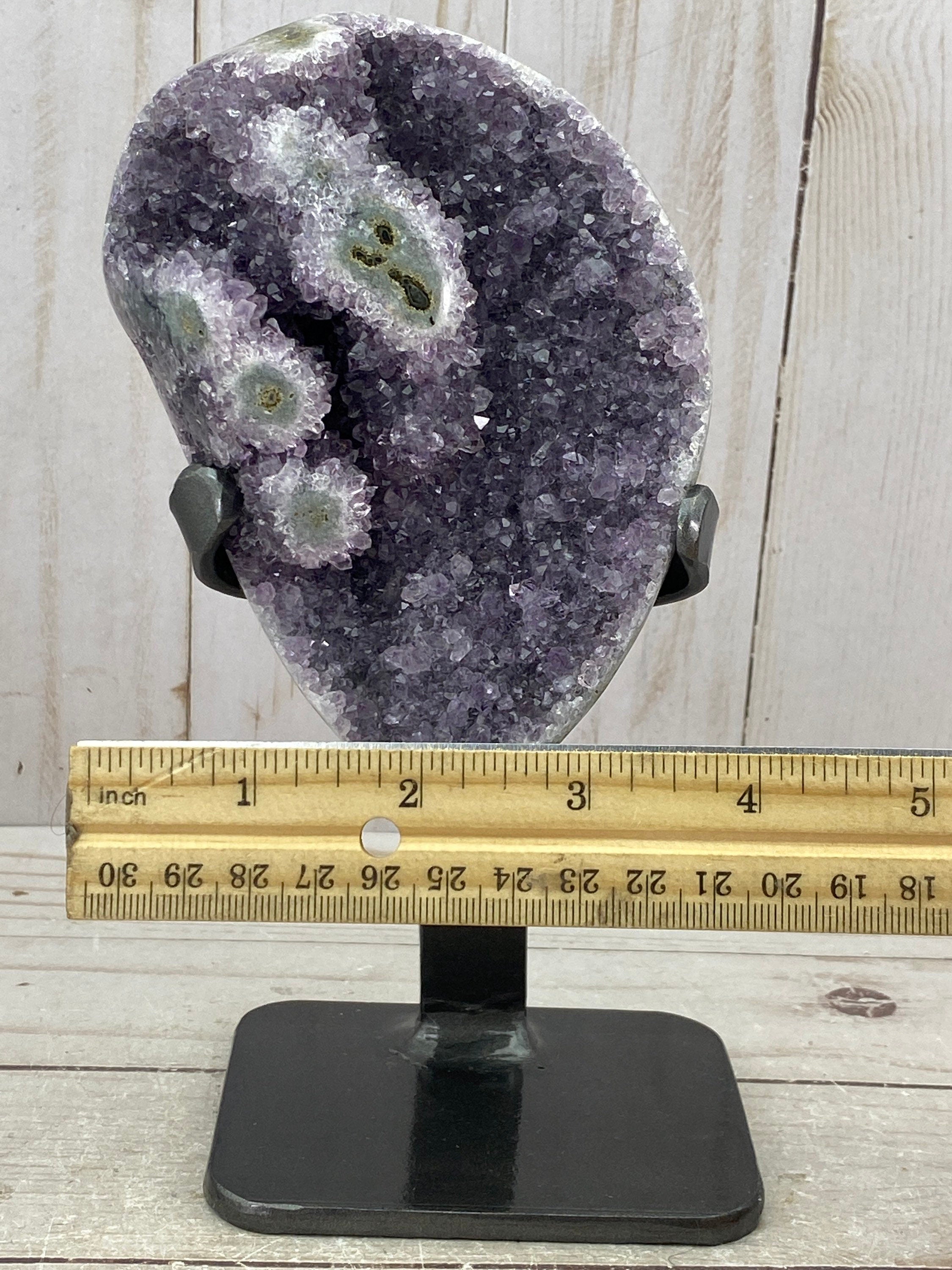 Amethyst geode with stalactite eyes