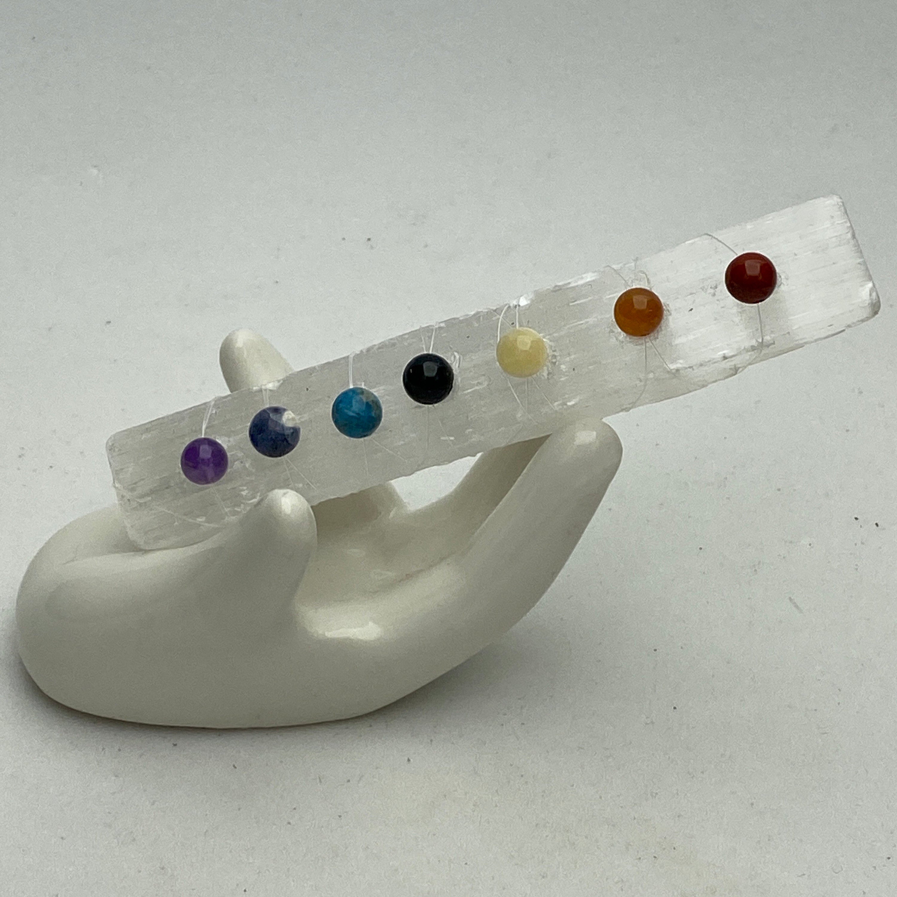 Seven Chakra stones on a selenite crystal wand