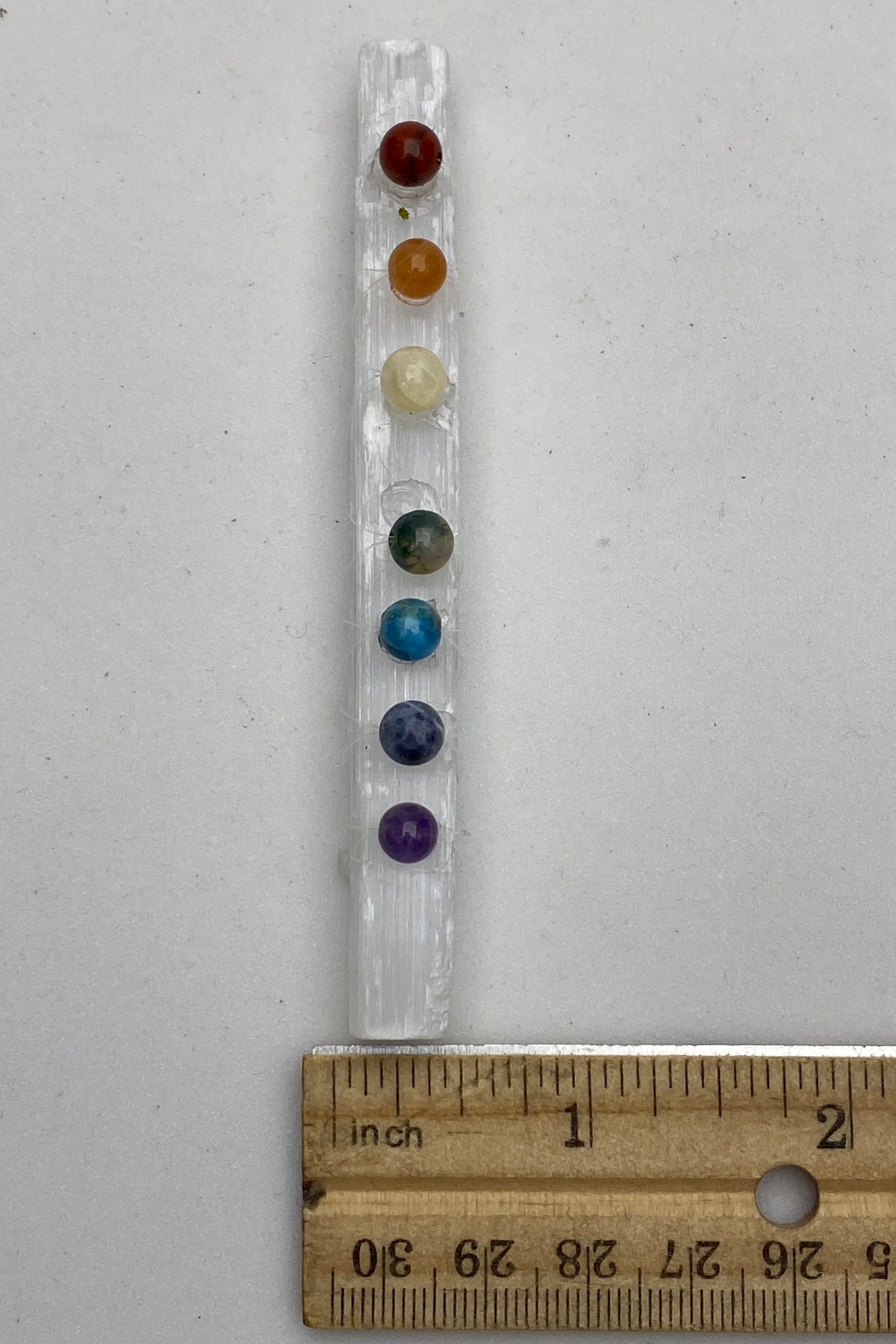 Seven Chakra stones on a selenite crystal wand