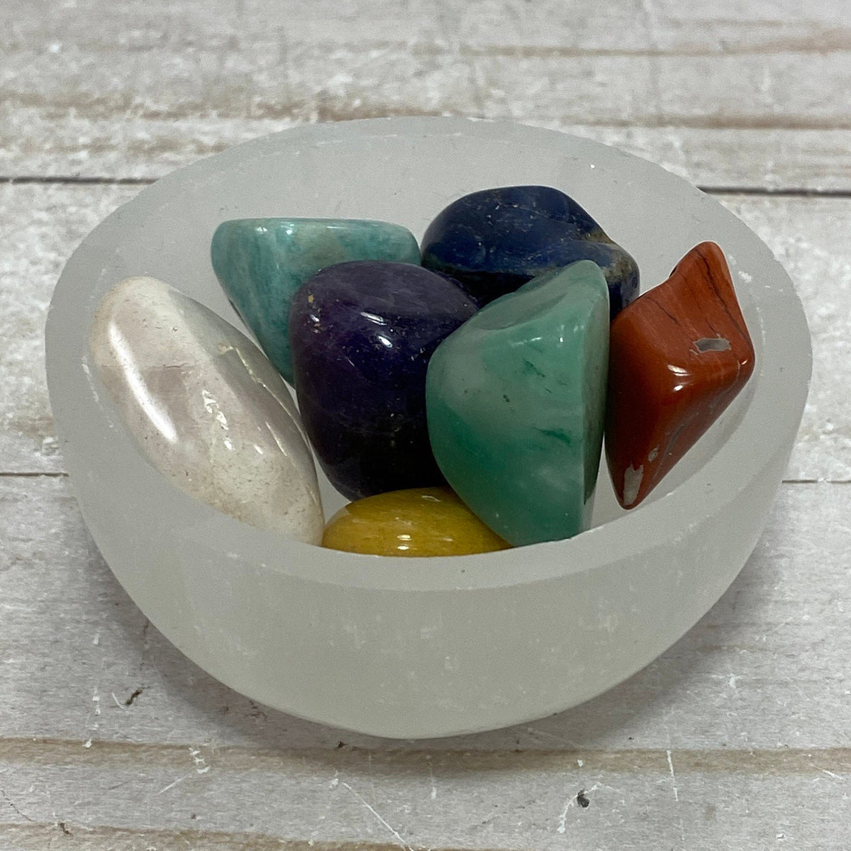 Chakra stones in a Selenite charging bowl